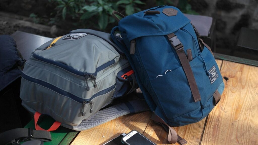 Image of two travel backpacks on a wooden table